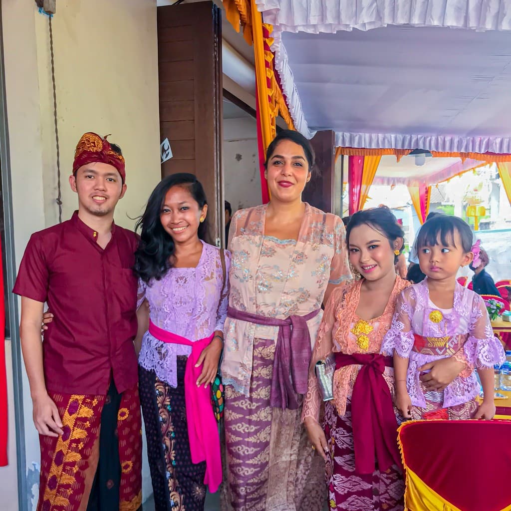 Pam wearing traditional Balinese attire at a ceremony